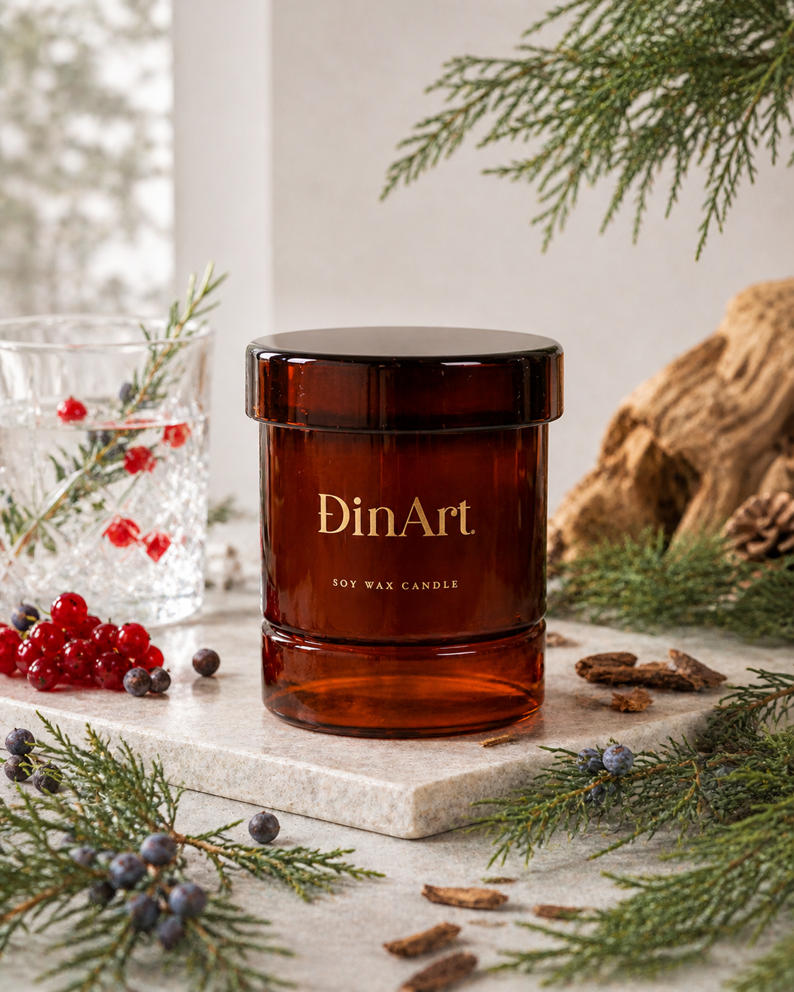 DinArt soy wax candle in a brown glass jar with decorative elements on a light surface.